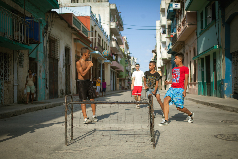 10 Things To Know Before Traveling To Cuba.  Boys playing soccer in Havana, Cuba.