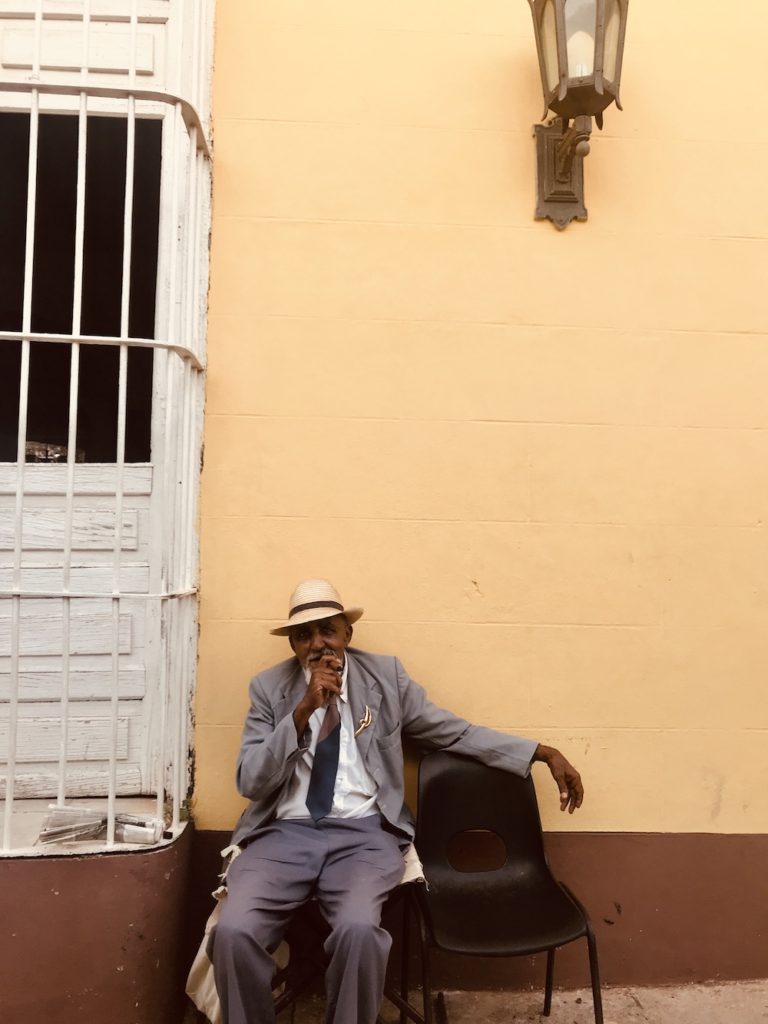 The Complete Trinidad, Cuba Travel Guide.  My friend Miguel posing with a cigar in Plaza Mayor.  