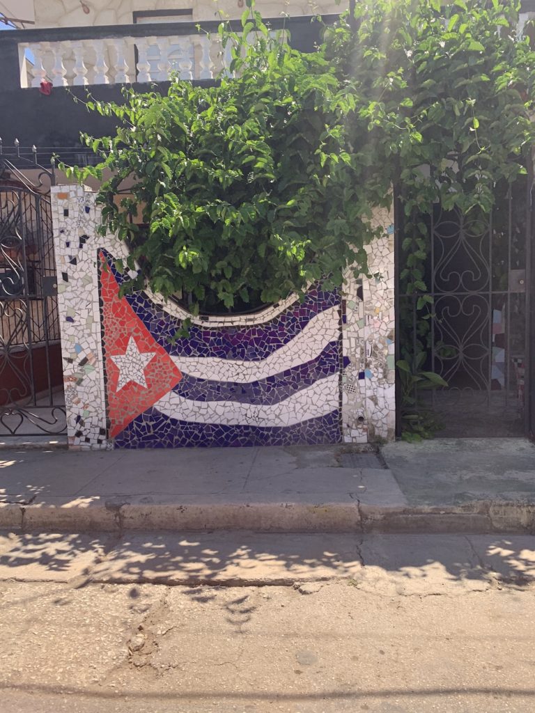 Complete travel guide for first time visitors.  Beautiful Cuba flag near Fusterlandia in Havana, Cuba.