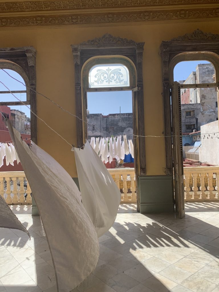 10 Things To Know Before Traveling To Cuba.  Linens drying inside La Guarida. 