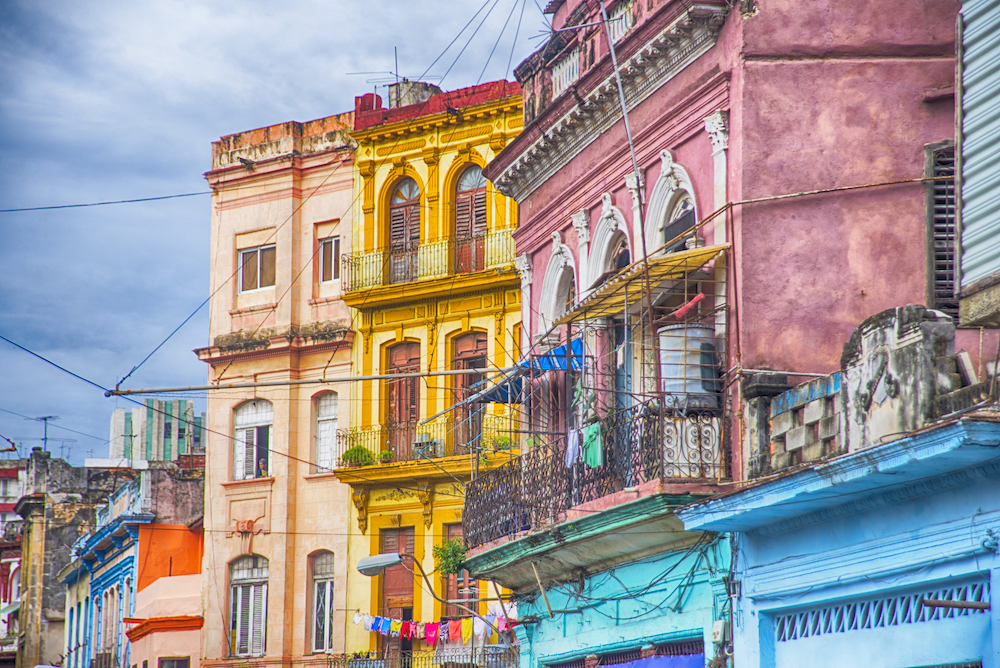 The Ultimate Cuba Bucket List: 101 Fun Things To Do in Cuba.  Colorful Spanish-colonial buildings in Old Havana, Cuba. A UNESCO World Heritage site in 1982.