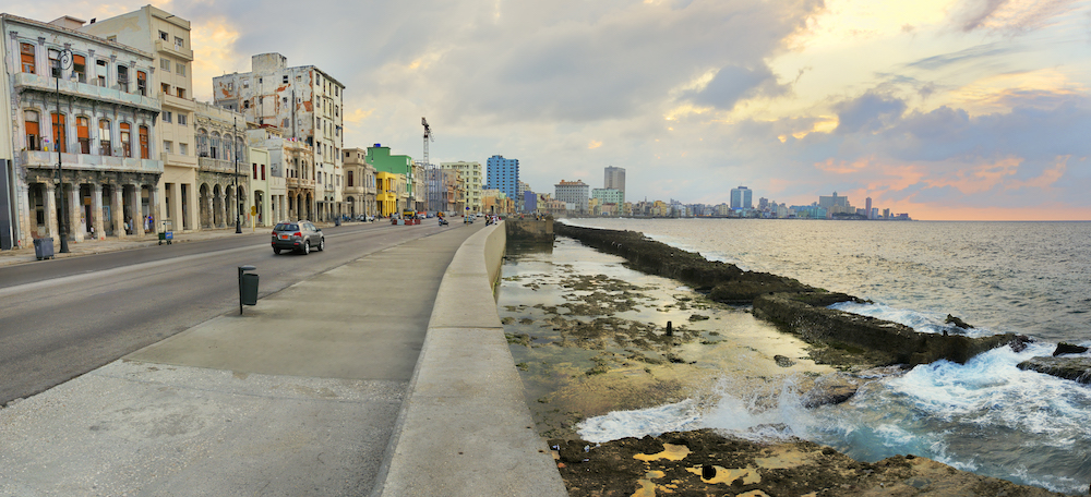 10 Things To Know Before Traveling To Cuba.  Panoramic view of Havana bay and city skyline along the Malecon at sunset. 