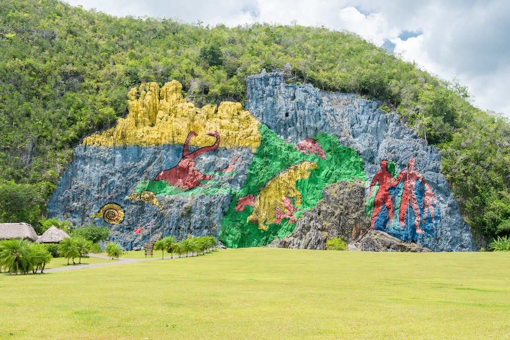 How To Take The Perfect Day Trip From Havana To Viñales.  Paintings at the prehistoric mural in vinales valley, Cuba