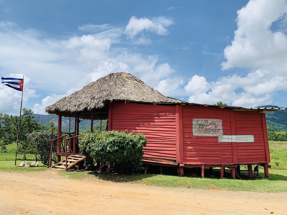 The Ultimate Cuba Travel Guide.  Image of colorful building in a tobacco farm in Vinales, Cuba.