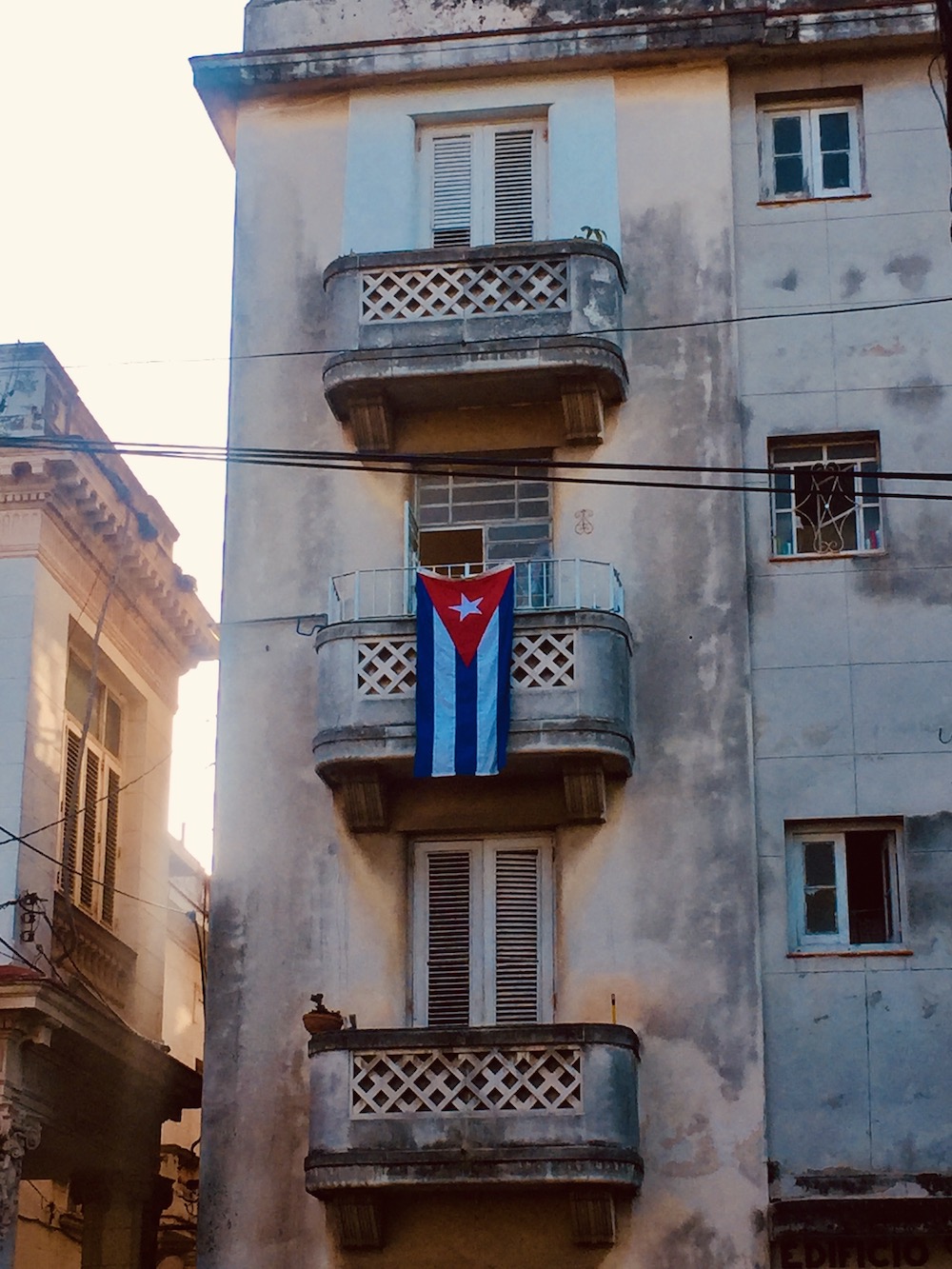 10 Things To Know Before Traveling To Cuba.  Cuban flag in Vedado, a district in Havana. 