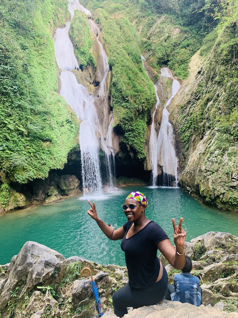 The Ultimate Cuba Travel Guide.   Lady Chin in front of Salto de Caburni in Trinidad, Cuba. 