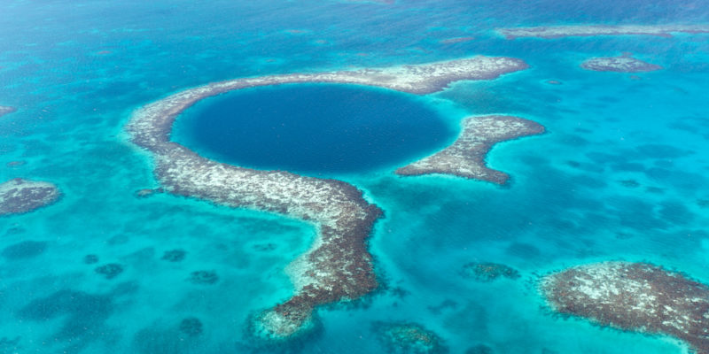 17 Best Things to do in Ambergris Caye, Belize - Aerial view of coral reefs of the Blue hole in Belize