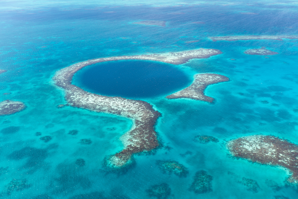 17 Best Things to do in Ambergris Caye, Belize - Aerial view of coral reefs of the Blue hole in Belize