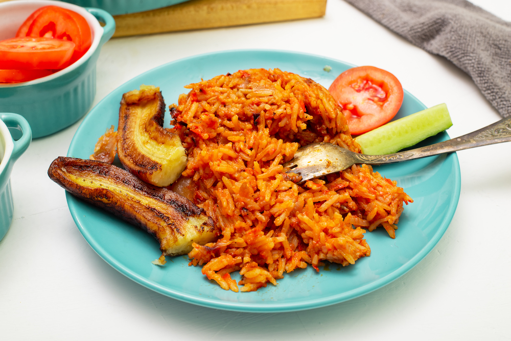 The Ultimate Lagos, Nigeria Travel Guide: For First-Time Visitors.  Jollof rice with fried banana on a plate. 