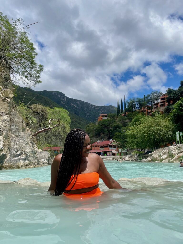 Imagine of Lady Chin with scenic background at Grutas Tolantongo in Hidalgo, Mexico.