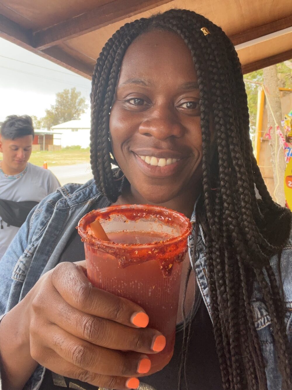 Lady Chin with a cup of Michelada in Hidalgo, Mexico. 