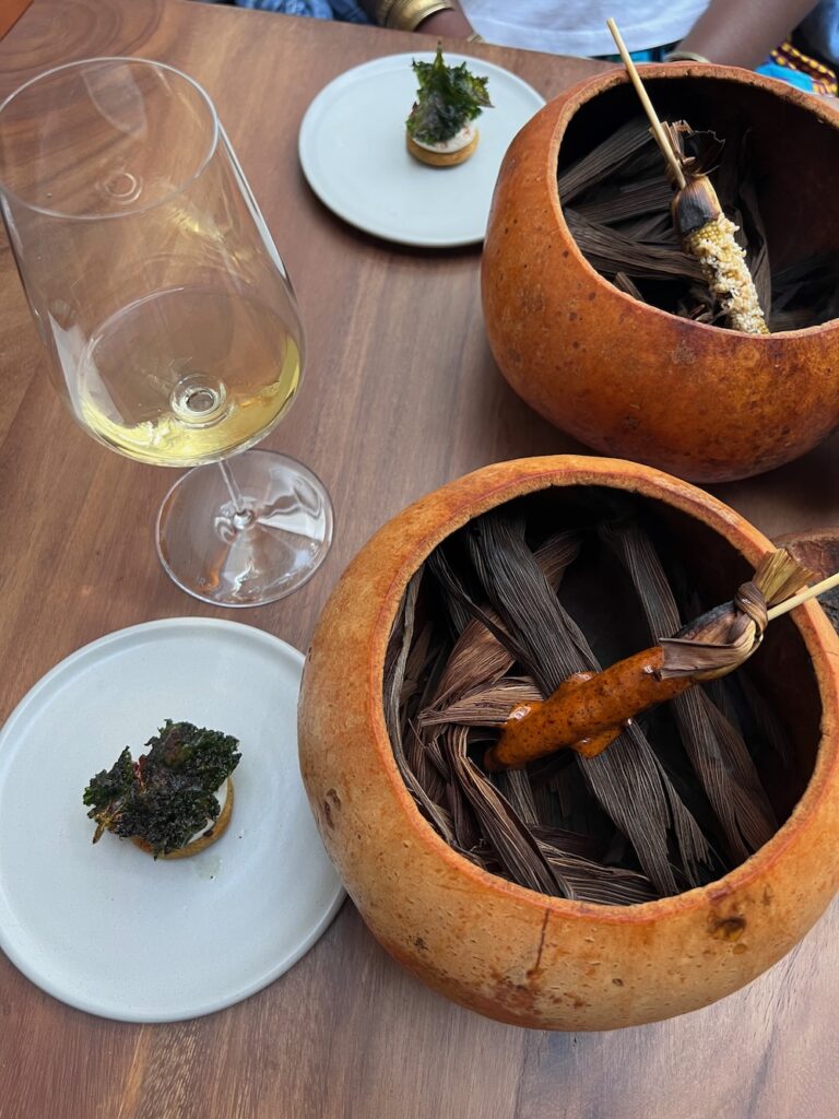 Image of baby corn tossed with costeño chile mayonnaise and powdered with chicatana ants at Pujol in Mexico City.