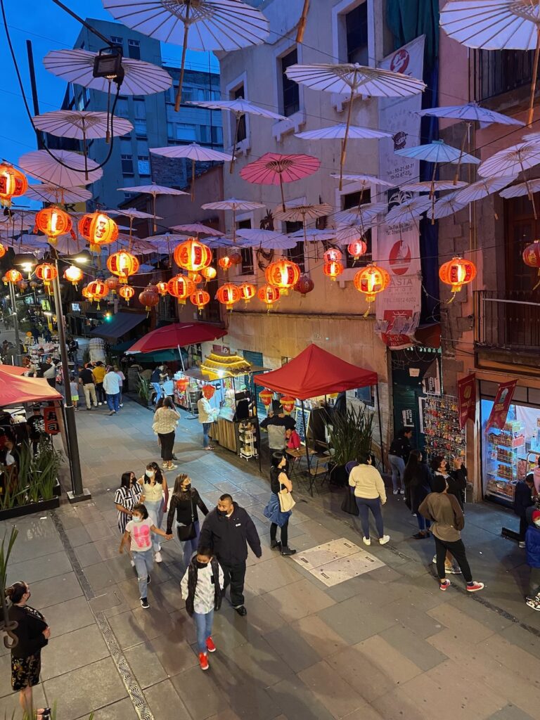 Image of lanterns lit up at night in Barrio Chino in CDMX.