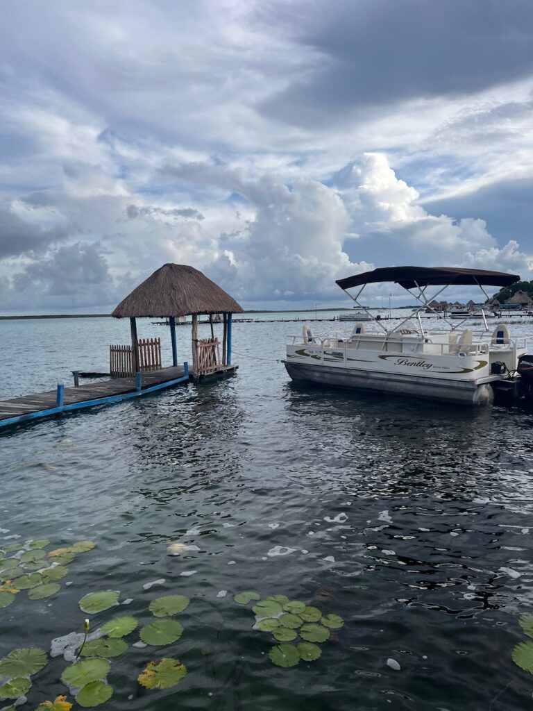 Gazebo and boat on the Bacalar Lagoon. 