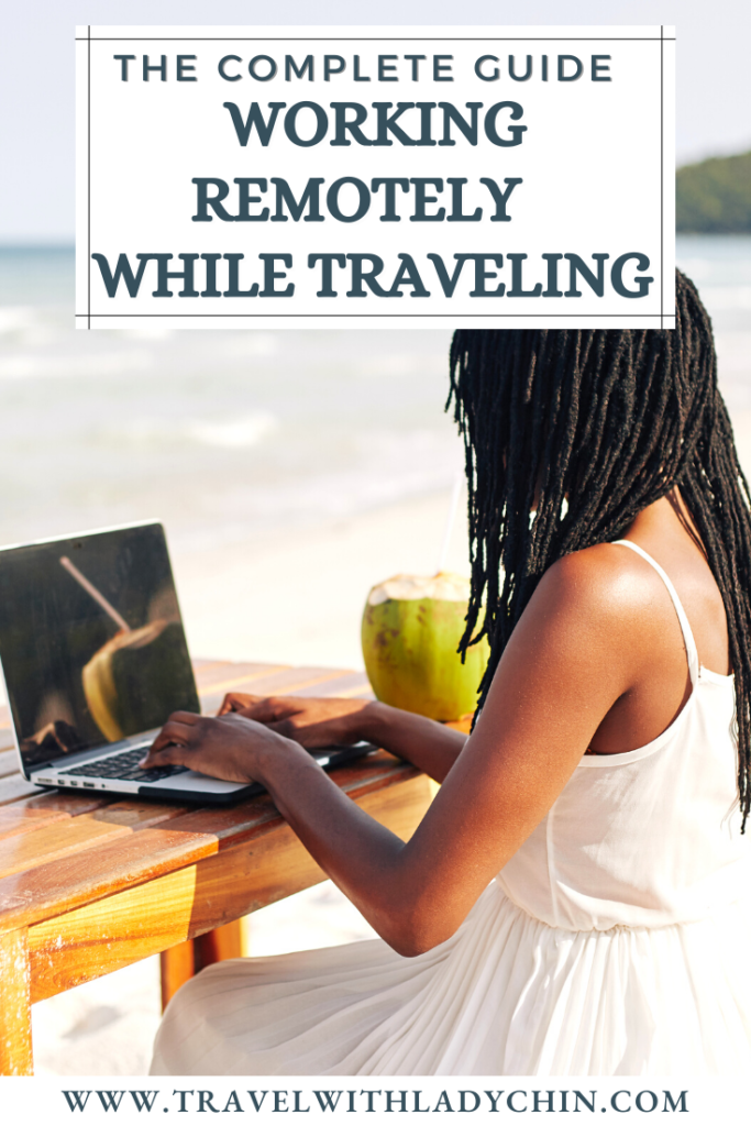 The complete guide to work and travel Pinterest Pin of Black women working on her laptop on a beach with coconut.