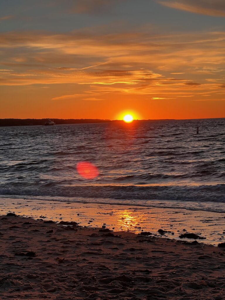 Sunset at Menemsha beach over the vineyard sound