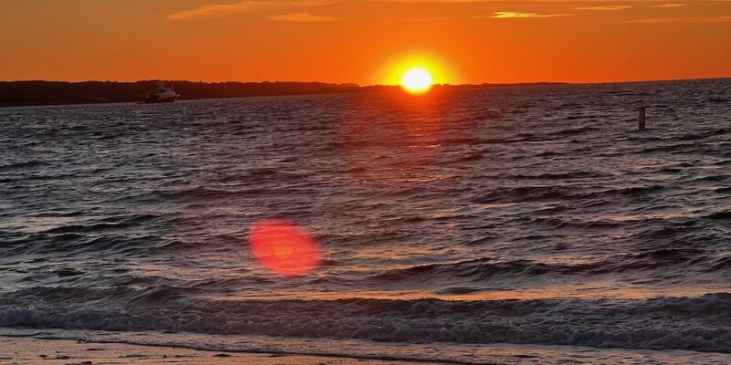 Sunset at Menemsha beach over the vineyard sound