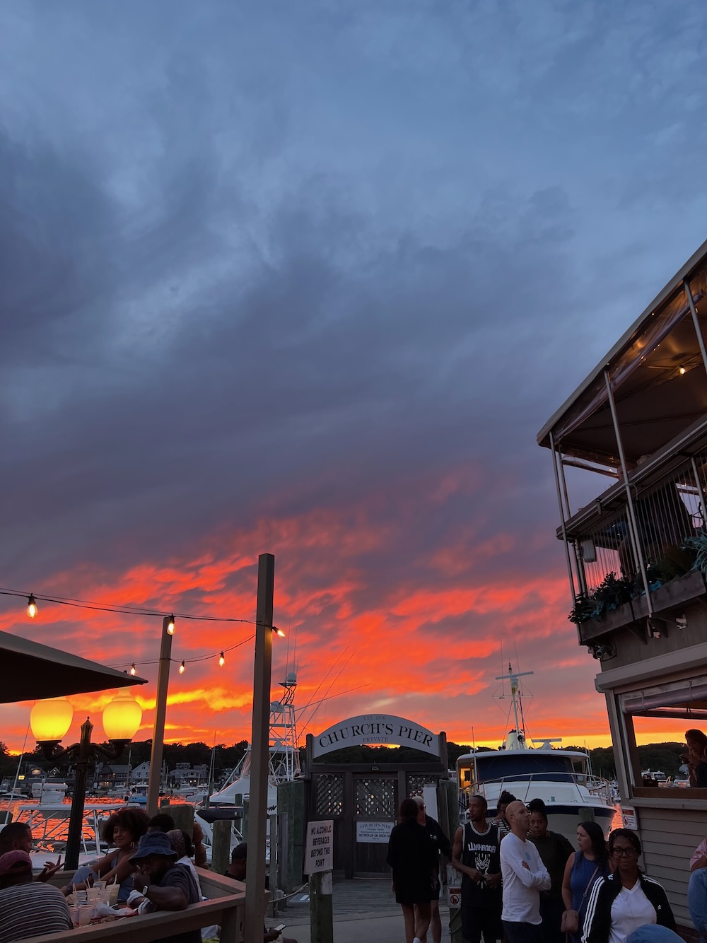 Exquisite sunset overlooking church's pier in front of Nancy's snack bar in Oak Bluffs, Martha's Vineyard. 