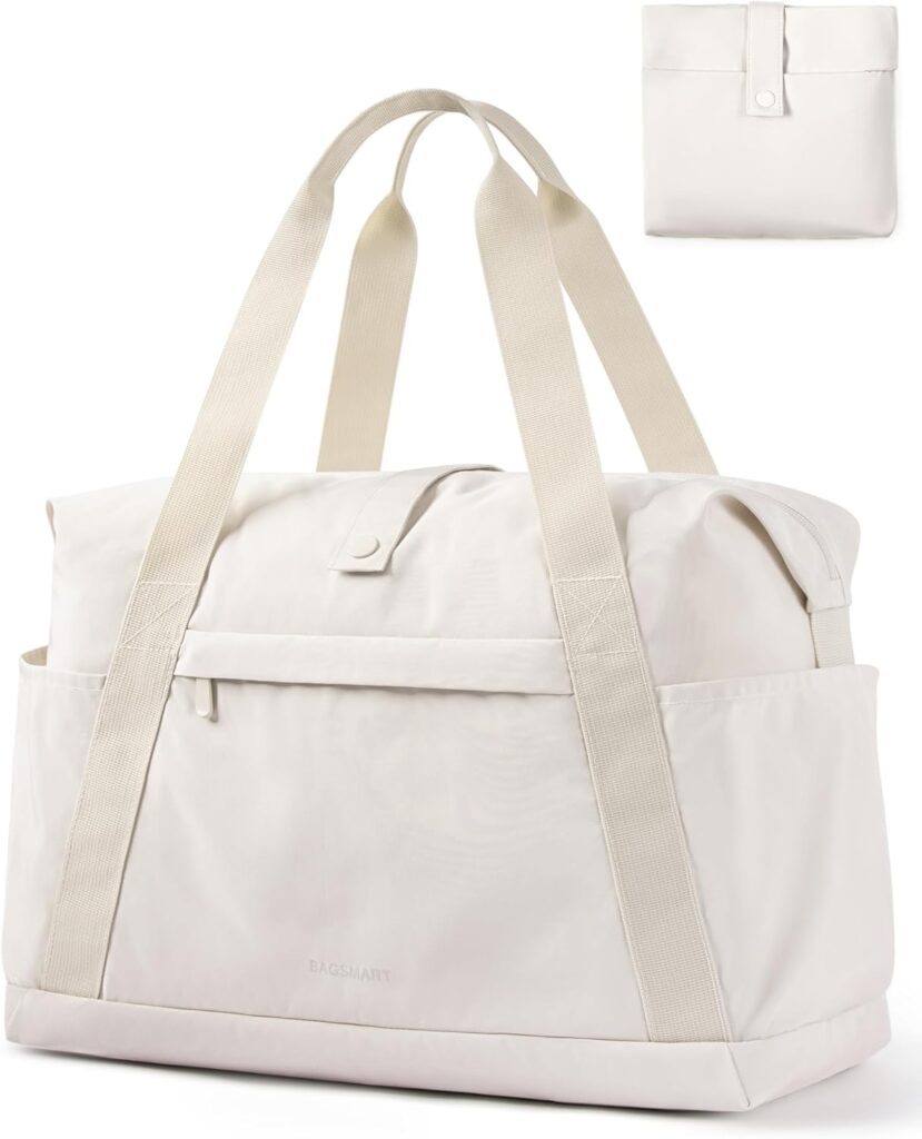 Cream foldable travel duffle bag with cream straps.