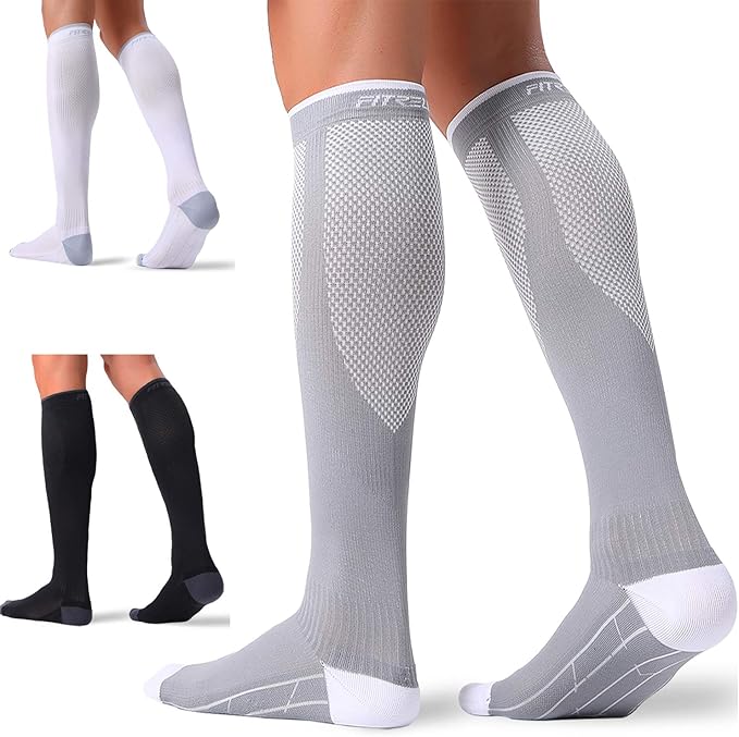 3 sets of compression socks: 2 Grey and white 1 pair black with grey heels. 